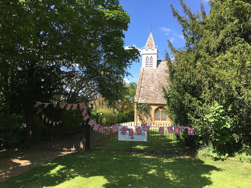 May 14, 2020.  Thankyou banner and flag buntings on the church fence